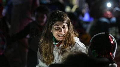 Abu Dhabi, United Arab Emirates - People enjoy during the singing of Christmas carols by candlelight in the desert. Khushnum Bhandari for The National