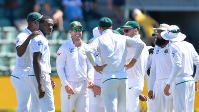 Kagiso Rabada, second left, is congratulated after claiming the wicket of David Warner. Ashley Vlotman / Getty Images