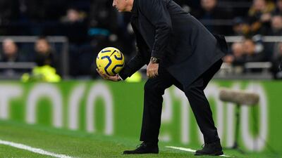 Jose Mourinho retrieves the ball during the match against Bournemouth. EPA