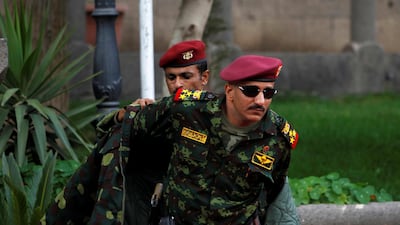 Gen Tariq Saleh, a nephew of former Yemeni president Ali Abdullah Saleh, puts on his coat at the Republican Palace in Sanaa, Yemen on January 10, 2011. He was killed by the Houthi rebels this week. Khaled Abdullah / Reuters