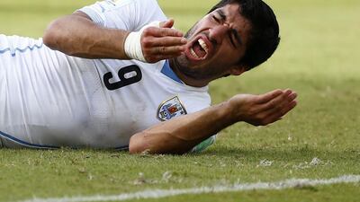 Uruguay's Luis Suarez reacts after clashing with Italy's Giorgio Chiellini during their 2014 World Cup Group D match at the Dunas arena in Natal on June 24, 2014. Tony Gentile / Reuters
