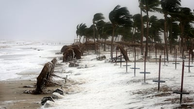 Debris and sea foam litters a beach hit by Cyclone Mekunu in Salalah, Oman, on May 26, 2018. Kamran Jebreili / AP