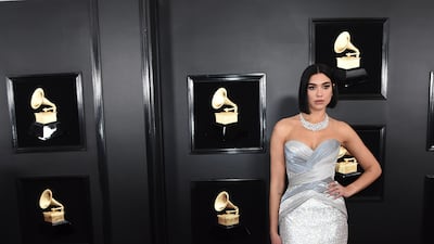 Dua Lipa looks absolutely stunning in diamond-chic Atelier Versace. Photo: AP