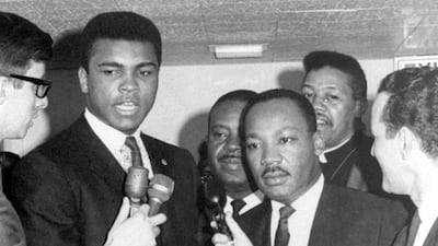 In this March 29, 1967, file photo, heavyweight champion Muhammad Ali, centre left, and Dr Martin Luther King speak to reporters. AP Photo