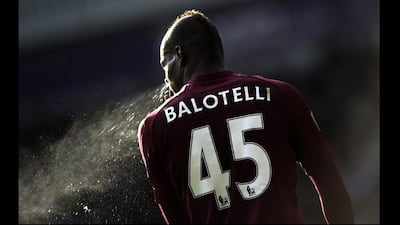 Manchester City's Italian forward Mario Balotelli clears his nose during the game against West Bromwich Albion during their English Premier League football match at The Hawthorns in West Bromwich, England. Adrian Dennis / AFP