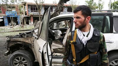 Two blasts that struck the convoy of presidential candidate Abdullah Abdullah in Kabul killed at least six people and wounded more than 20. Rahmat Gul / AP Photo / June 6, 2014