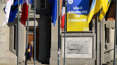 The Ukrainian flag flies outside Lille Town Hall, where the UK government is sending Ukrainian refugees applying to enter Britain. Getty