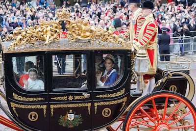 Britain's young Princess Charlotte and her mother Catherine, the Princess of Wales in a carriage ride after the coronation. AFP