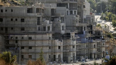Buildings under construction in the Kiryat Arba Jewish settlement on the outskirts of Hebron. Hazem Bader / AFP