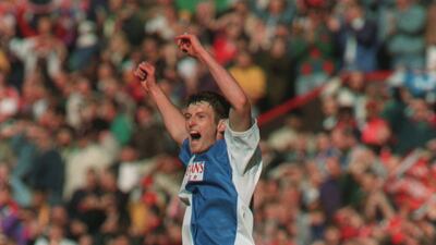 Chris Sutton celebrates after Blackburn win the title. Getty