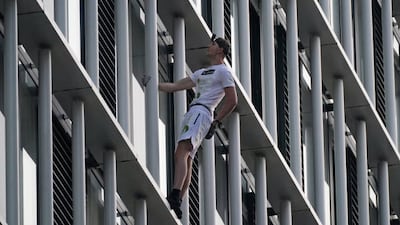 Free-solo climber George King ascends Stratosphere Tower in Stratford, east London. Getty