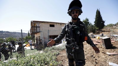 An Israeli soldier stands guard as authorities demolish the structure in Bethlehem. According to Palestinian reports, the building belonging to Ramzi Qaisiyya EPA