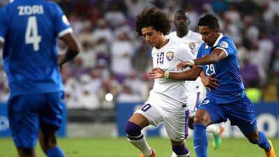 Omar Abdulrahman, centre, will stay with Al Ain. Marwan Naamani / AFP