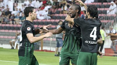 Makhete Diop, centre, is congratulated by teammates after scoring for Shabab Al Ahli Dubai club in their 4-1 win over Hatta. Pawan Singh / The National