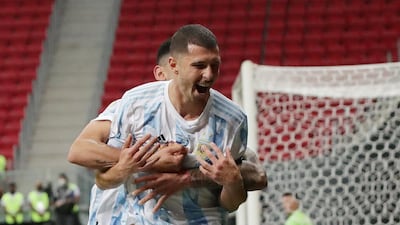 Argentina's Guido Rodriguez celebrates scoring their goal with Cristian Romero. Reuters