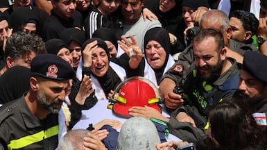 Mourners at a funeral procession for Lebanese Civil Defence workers Hussein Jaber and Ahmad Noura, killed in a direct Israeli strike. EPA