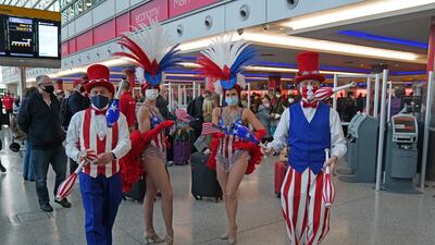 Performers entertain passengers at Heathrow Airport. Thousands of travellers are jetting off on transatlantic flights for long-awaited reunions with relatives and friends