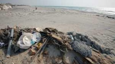 Construction material and rubbish is dumped on the public beach in Umm al Qaiwain.