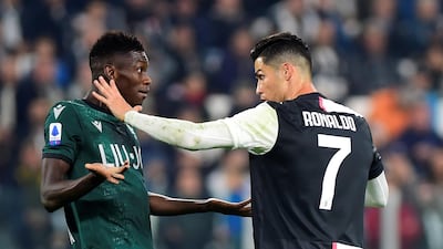 Soccer Football - Serie A - Juventus v Bologna - Allianz Stadium, Turin, Italy Juventus' Cristiano Ronaldo and Bologna's Ibrahima Mbaye clash. REUTERS