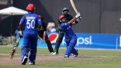 Mohammad Nabi, Afghanistan cricket captain, plays a shot at a World Cricket League match in Sharjah last October. Pawan Singh / The National / October 4, 2013