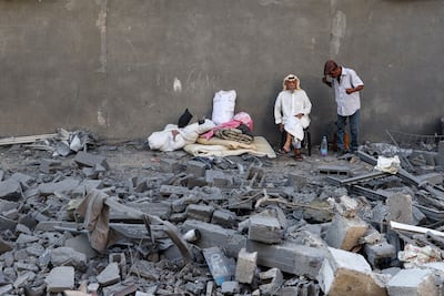 Palestinians displaced after air strikes in Deir Al Balah in the central Gaza Strip on Wednesday. AFP