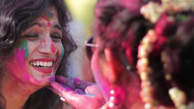 Indian students throw paint over each in Kolkata. EPA