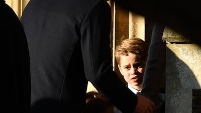 Britain's Prince George of Cambridge arrives for the Royal Family's traditional Christmas Day service at St Mary Magdalene Church. AFP