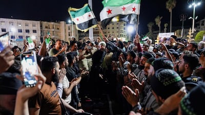 Syrians celebrate in Idlib after a court sentenced former leader Bashar Al Assad to death. Reuters