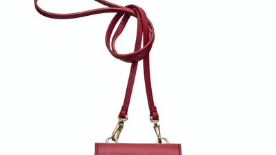 Tod’s: Sassy in deep burgundy, this shoulder cross-body carries the trademark double-T hardware, with a matching flap for city chic.