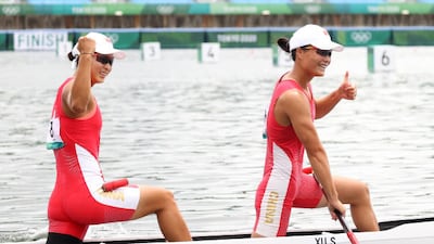 Gold medallists Xu Shixiao and Sun Mengya of Team China celebrate after winning the women's wanoe double 500m.