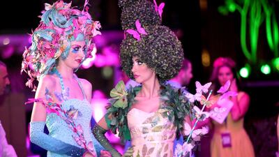 Women dressed up as Spring greeted guests during the fashion show.