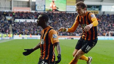Dame N'Doye of Hull City celebrates with teammate Nikica Jelavic after scoring the winner against QPR on Saturday. Nigel Roddis / Getty Images