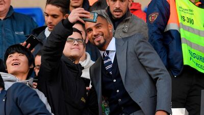 Barcelona's new Ghanaian forward Kevin-Prince Boateng poses for a selfie with fans at Camp Nou. AFP