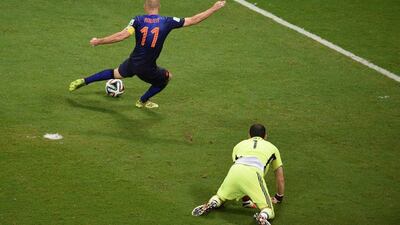 Arjen Robben shoots to score Netherlands' second goal against Spain on Friday night at the 2014 World Cup in Salvador, Spain. Dimitar Dilkoff / AFP