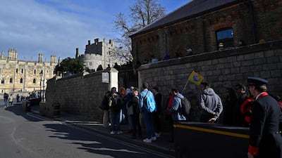 The queues do not quite match those that snaked through London to see the queen's coffin lying in state, but dozens of tourists and royal fans were in line for reopening day. AFP