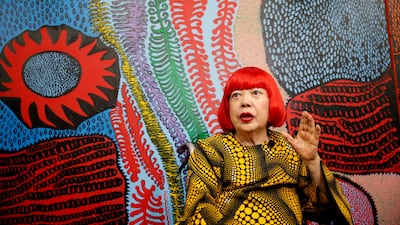 Kusama speaks to journalists at her studio in Tokyo. Reuters