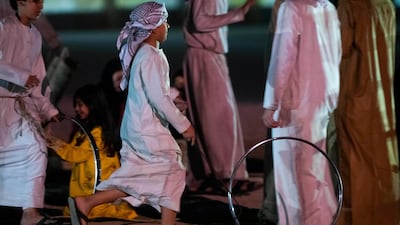 Performers participate in a show during the opening of Qasr Al Hosn.