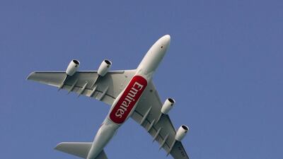 An Emirates Airbus A380 flies over Dubai. Ali Haider / EPA