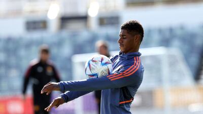 Manchester United's Marcus Rashford balances the ball on his arms during a training session in Perth. AFP
