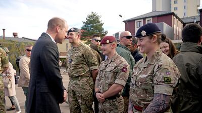 Prince William meets members of the British military. Getty