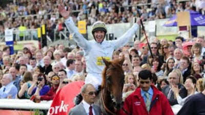 Frankie Dettori and Conduit celebrate their win in the Ladbrokes St Leger Race.