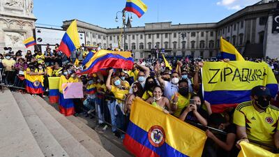 Colombian fans near the podium after Team Ineos rider Egan Bernal won the Giro d'Italia 2021. AFP