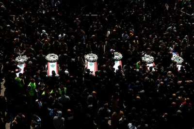 Mourners gather around the coffins of thirteen bodies from the Lebanese State Security Forces members killed by Israel during a funeral procession in the southern coastal city of Sidon. EPA