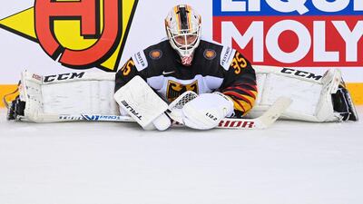 Germany netminder Mathias Niederberger stretches ahead of a shootout in the IIHF ice hockey World Championships quarter-final against Switzerland, at the Olympic Sports Center in Riga, Latvia, on Thursday, June 3. Germany won the shootout. AFP