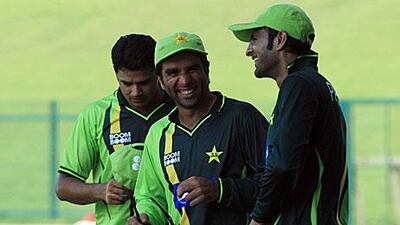 From right; Shoaib Malik, Taufeeq Umar and Azhar Ali smile at Pakistan's nets practice ahead of their first Test against Sri Laka at the Zayed Cricket Stadium in Abu Dhabi.
