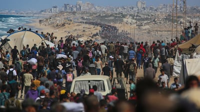 Thousands of displaced Palestinians return to Gaza city from Nuseirat, using Al Rashid road, after the ceasefire between Israel and Hamas was announced. AFP