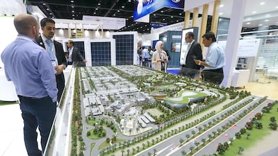 Solar projects in the UAE have set records for low bids on the cost of electricity in the past year. Satish Kumar / The National