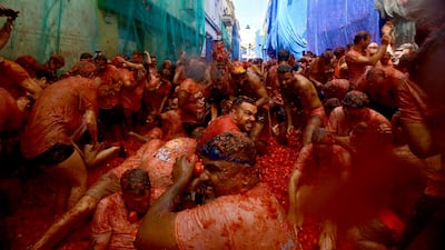 Revellers participate in the so-called Tomatina annual food fight, in the eastern Spanish town of Bunol. AFP