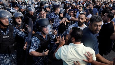 The men overran the protest encampment in downtown Beirut, smashing tents and setting them on fire as they attempted to clear the demonstrations. AP