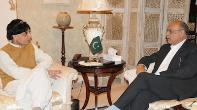 Pakistani Interior Minister Chaudhry Nisar Ali Khan, left, speaks with senior Pakistan Cricket Board (PCB) official Najam Sethi. AFP